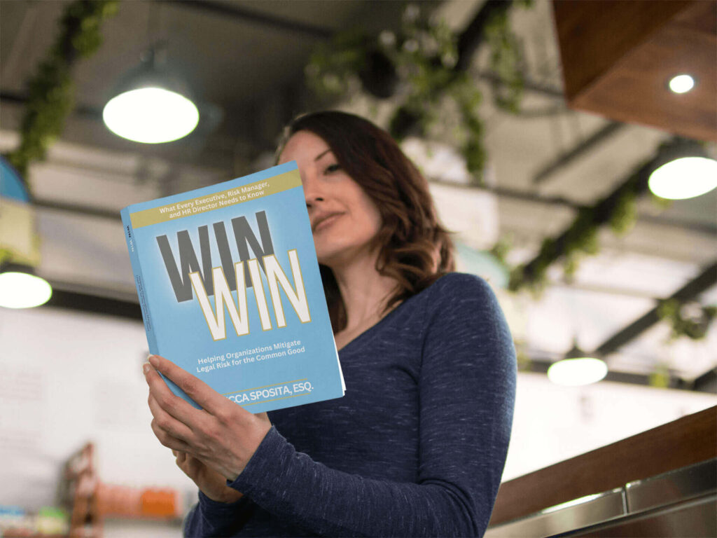 girl reading a book at a convention